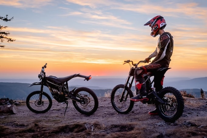 Electric motorbike rider contemplating the horizon