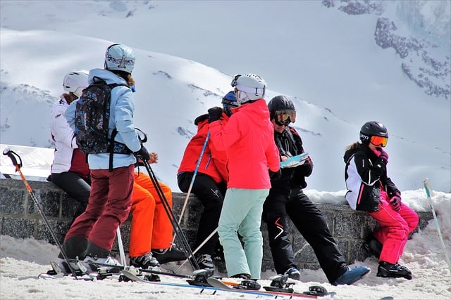 Family enjoying skiing on a snow-covered slope