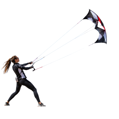 Kite flyer performing stunts on a windy beach