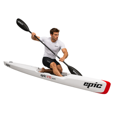 surfski paddler riding a downwind swell